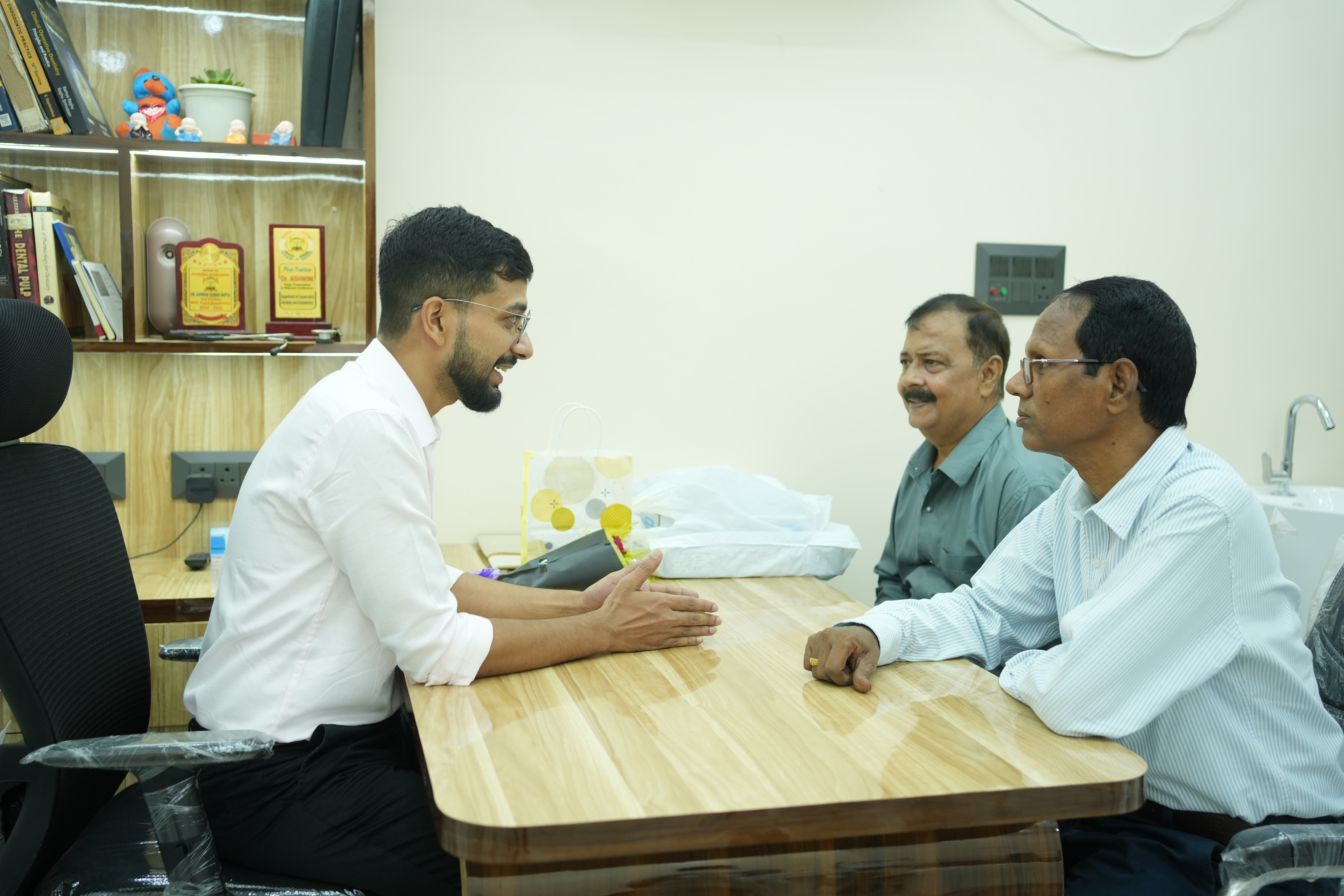 Dentists providing care to a patient in a clean, modern dental clinic.