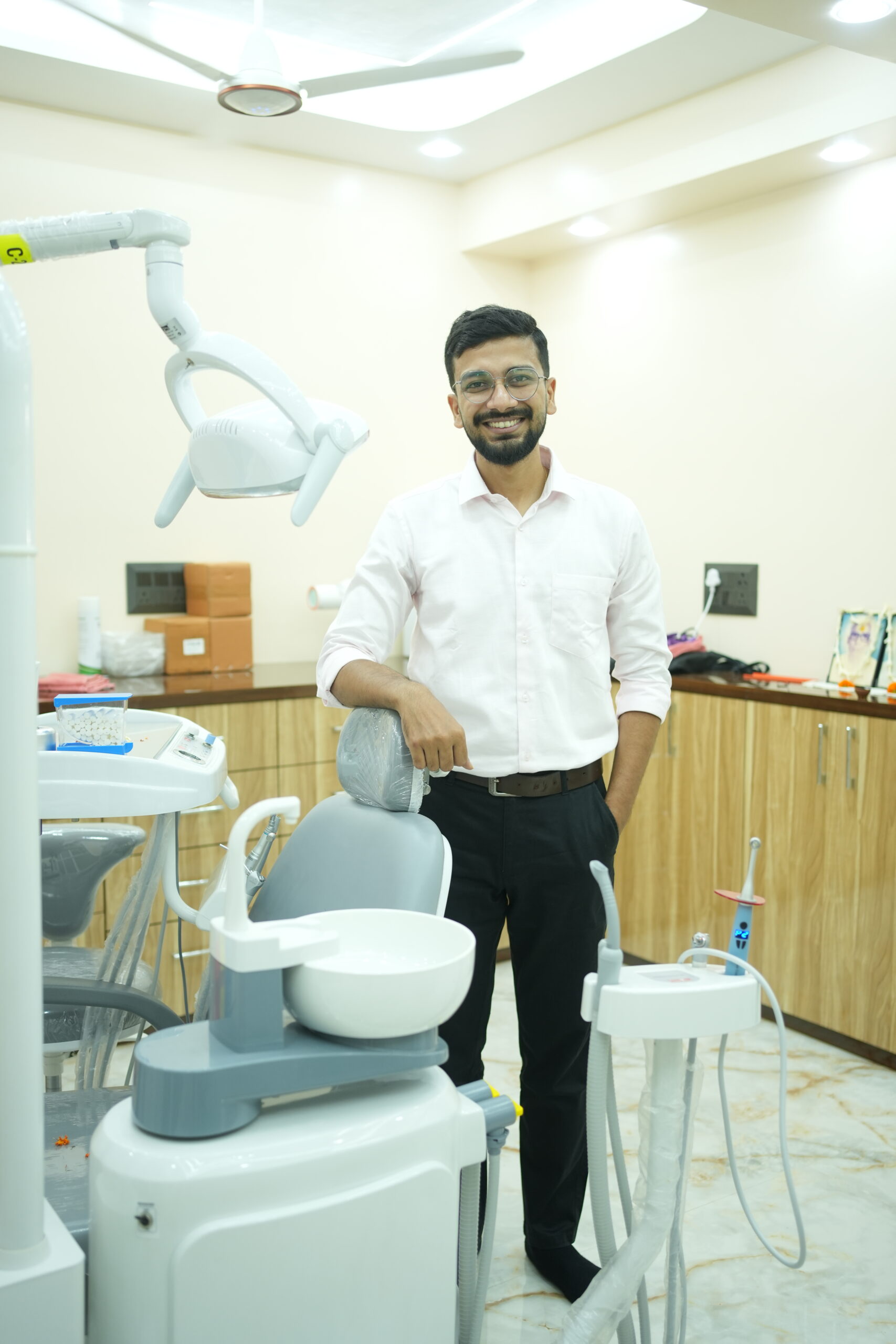 Crafting Captivating Headlines: Your awesome post title goes here A man in a dental chair during a checkup with a professional dentist using a mirror.